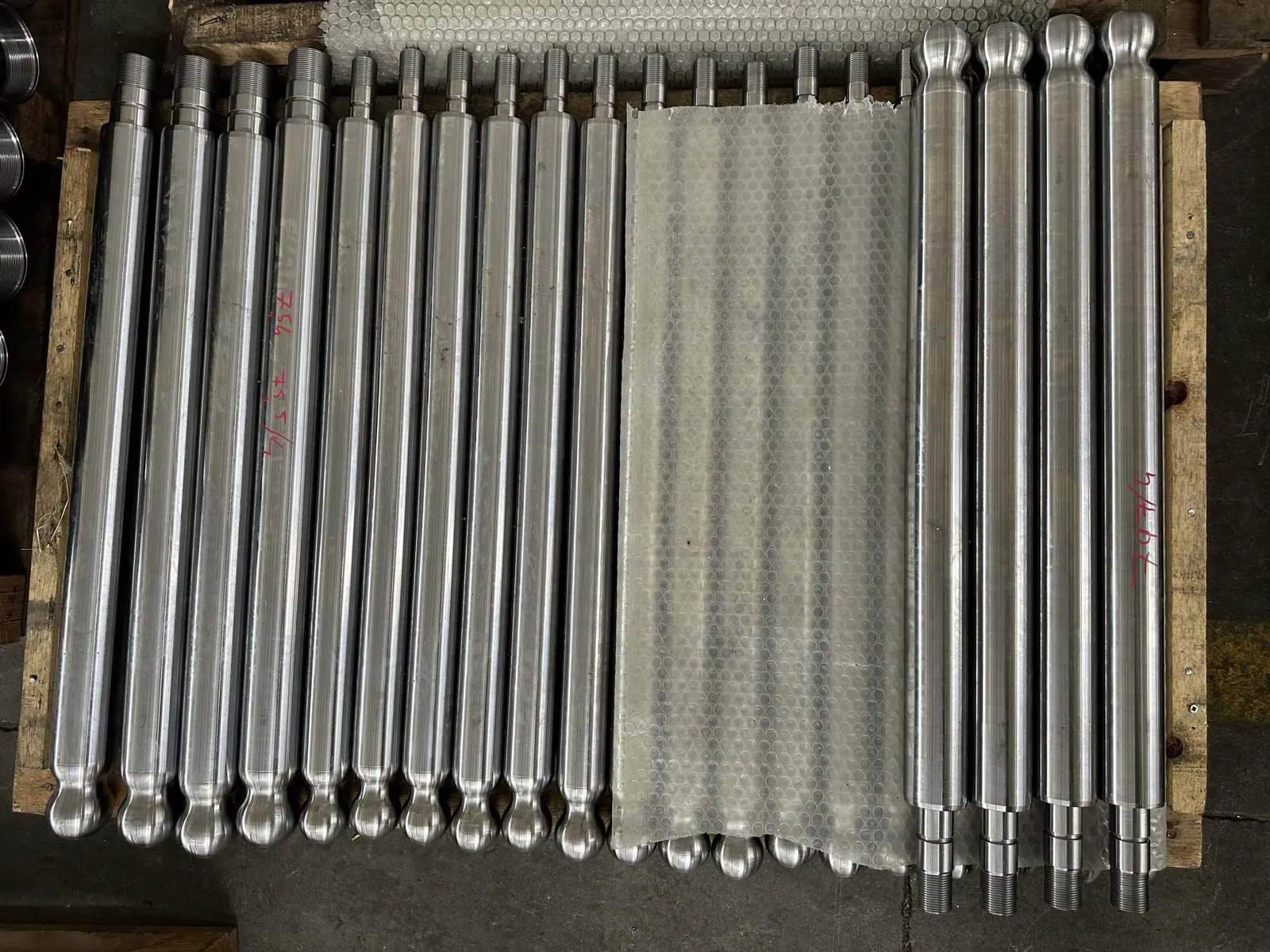 Chrome piston rods packed on a pallet