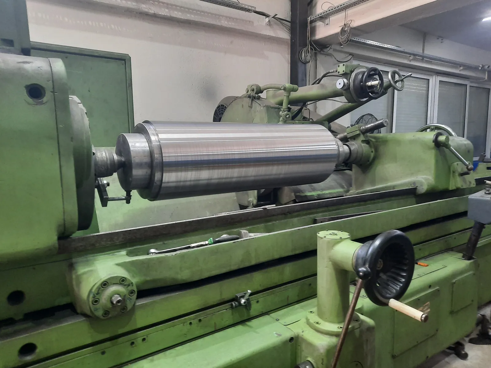 Steel roll ground between centres on a cylindrical grinding machine