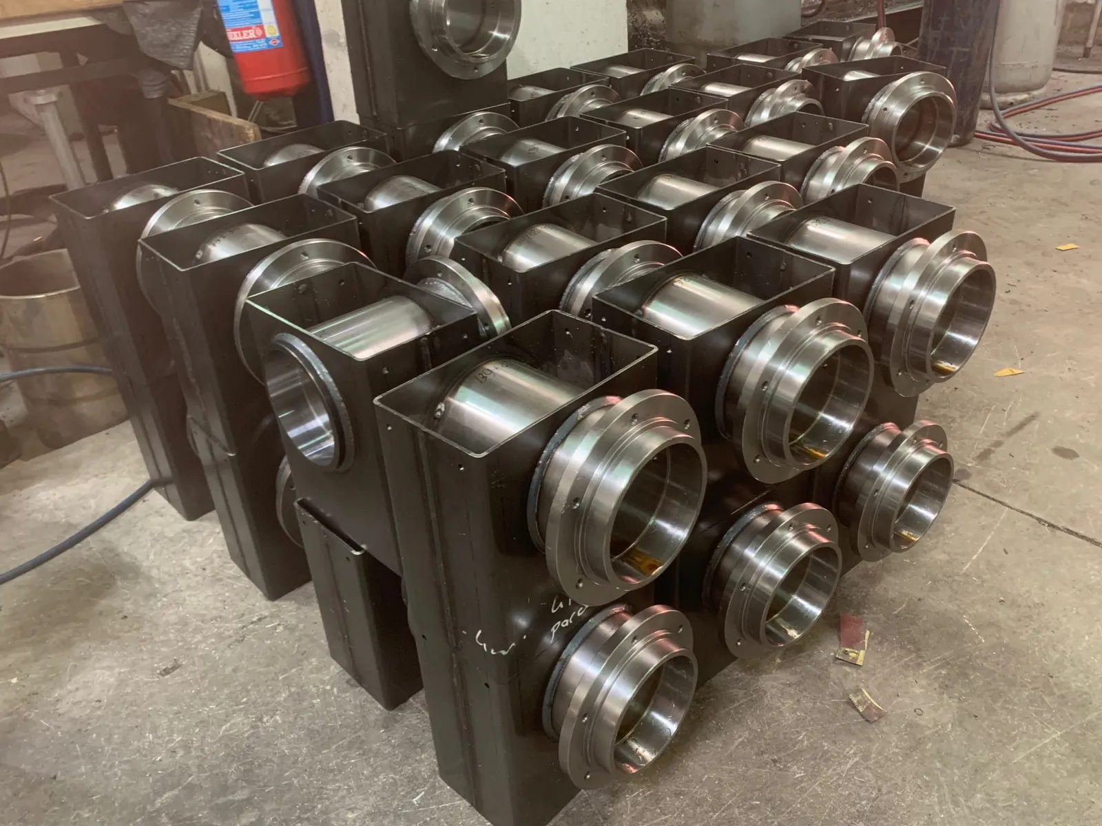 Machined bearing housings for rollers in series