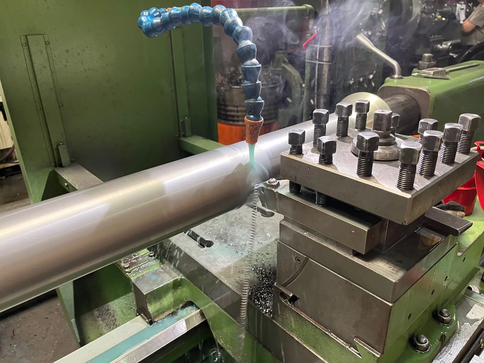 Roll shaft turned with coolant on lathe
