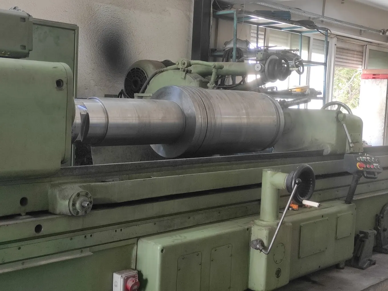 Stepped steel roll ground on a cylindrical grinder