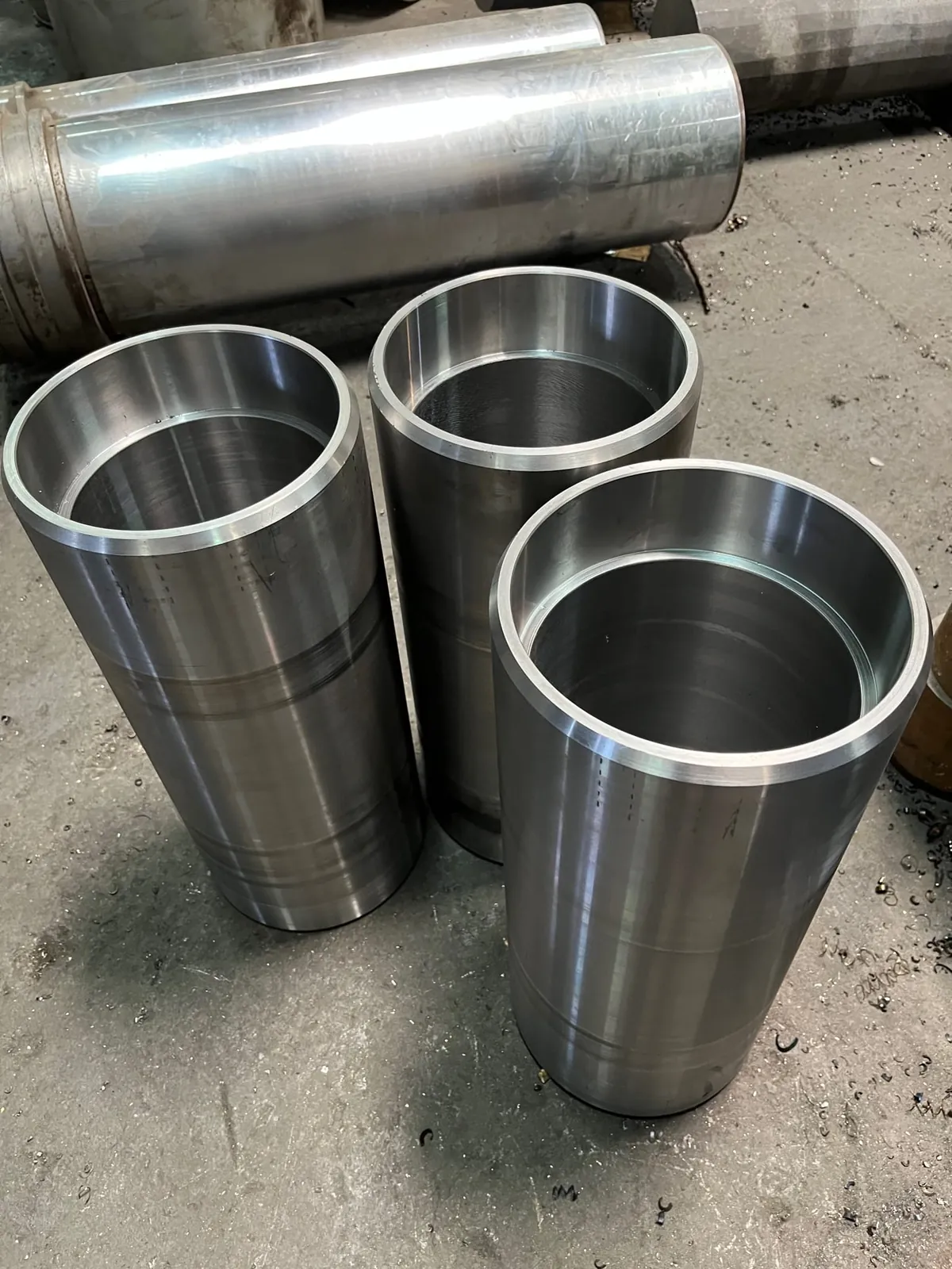 Turned steel sleeves and roller bushings