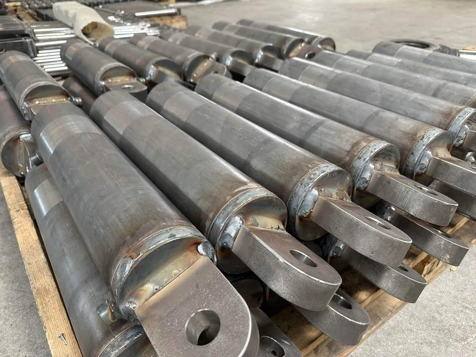 Welded cylinder barrels stacked after welding
